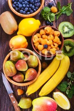 Fresh fruit on the wooden table, autumn fruits Stock Photos