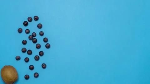 Fresh fruits moving on blue background. Stop motion Stock Footage 130242565