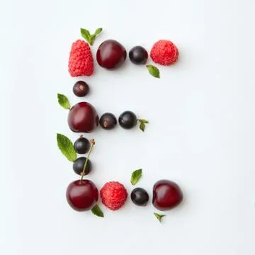 Fresh fruits pattern of letter E english alphabet from natural ripe berries - 스톡 사진