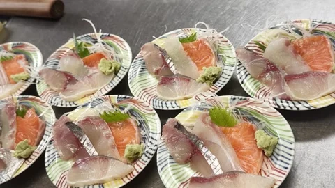 Fresh Fukui salmon sashimi assorted on small plates Stockbeeldmateriaal 339424968