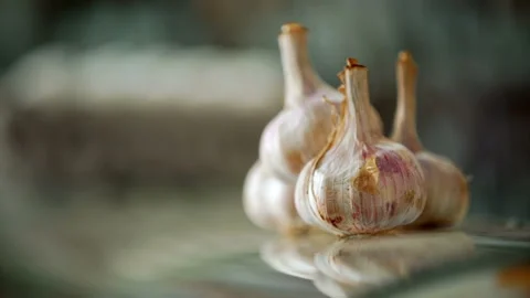 Fresh garlic and packaging of the eggs on a glass counter of the store  Stock Footage 119496746