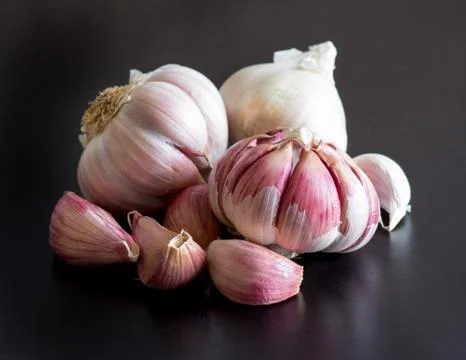Fresh garlic on a black table Stock Photos