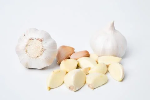 Fresh garlic isolated on a white background. Garlic is a species in the onion Stock Photos