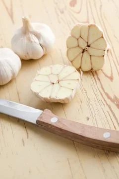 Fresh garlic on kitchen table Stock Photos