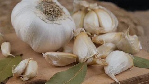 Fresh garlic rotating Video stock 246621228