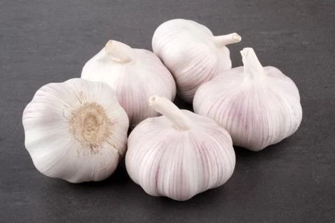 Fresh garlic on stone table Stock Photos