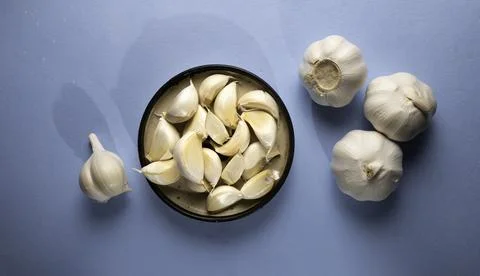 Fresh garlic on the table Stock Photos