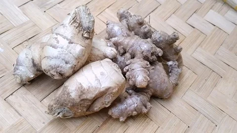 Fresh Ginger and Red Ginger Roots on Bamboo Mat Stock Footage 340538211