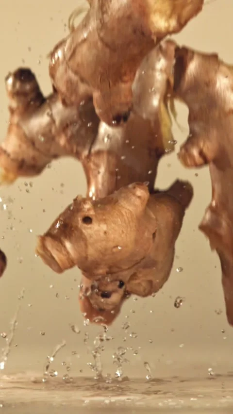 Fresh ginger falls on a bright table. Filmed on a high-speed camera at 1000 fps Stock Footage 335378616