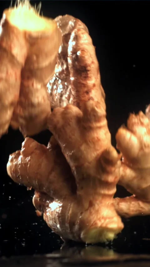Fresh ginger falls on the table. Filmed on a high-speed camera at 1000 fps Stock Footage 335309953