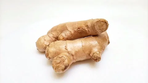 Fresh ginger rhizome or ginger root isolated rotating on white background Stock Footage 310997548