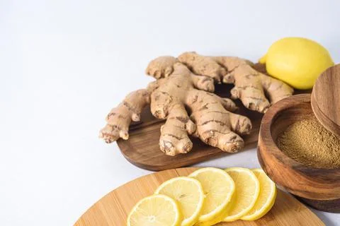 Fresh ginger root and lemons Stock Photos