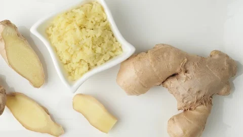 Fresh ginger root and minced ginger isolated on white 스톡 동영상 346177937