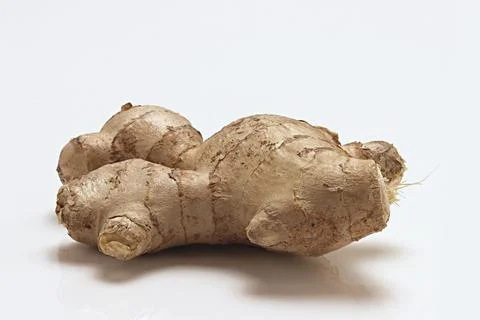 Fresh Ginger Root close up macro on white background Stock Photos