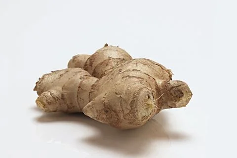 Fresh Ginger Root close up macro on white background Stock Photos