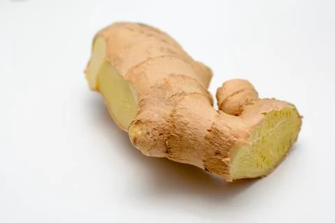 Fresh Ginger root cut and isolated on white Stock Photos