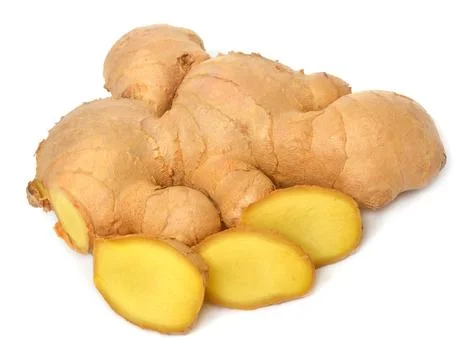 Fresh ginger root cut into cubes isolated on a white background Foto stock