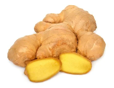 Fresh ginger root cut into cubes isolated on a white background Foto stock