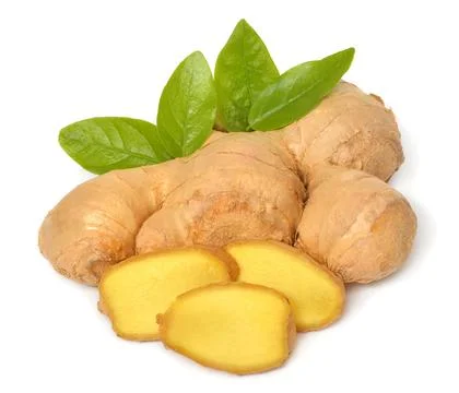 Fresh ginger root cut into cubes with leaves isolated on a white background Foto stock