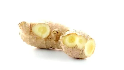 Fresh ginger root cut into pieces isolated on white background Stock Photos
