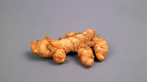 Fresh ginger root on gray background Stock Photos