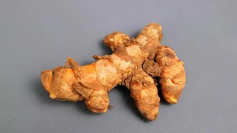 Fresh ginger root on gray background Stock Photos