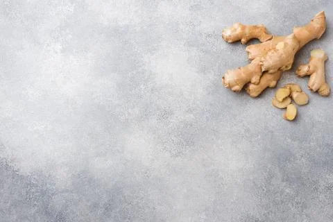 Fresh ginger root on grey background. Copy space. 스톡 사진