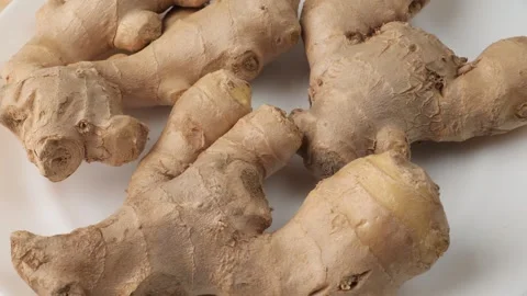 Fresh ginger root rotating on white background Stock-Footage 347099623