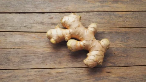 Fresh Ginger Root on Rustic Wooden Table Stock Footage 316990529