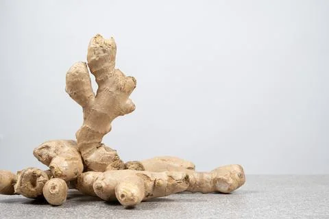 Fresh ginger root on white background, space for text Stock Photos
