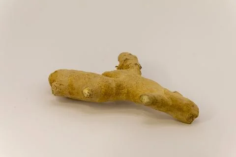 Fresh ginger root on a white background. Stock Photos