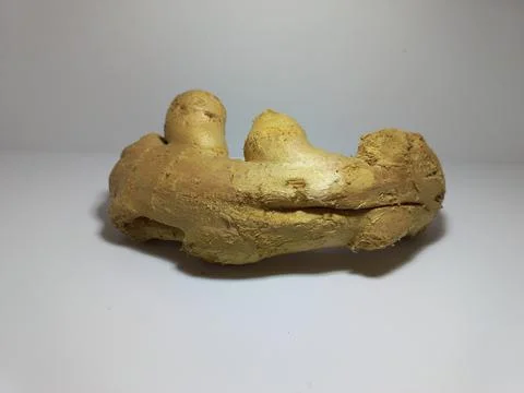 Fresh Ginger Root on White Surface Stock Photos