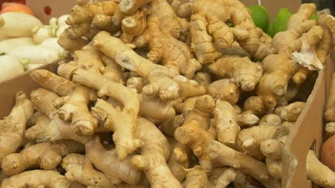 Fresh Ginger Roots Displayed at Farmers Market Representing Organic Spices and Stock Footage 325517607