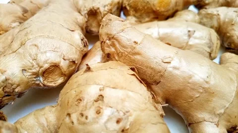 Fresh ginger roots or ginger rhizome rotating on white background, closeup Video stock 310999400