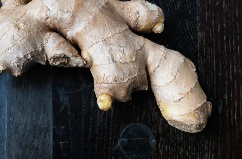 Fresh ginger on rustic background Stock Photos