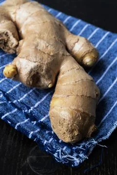 Fresh ginger on rustic background Stock Photos