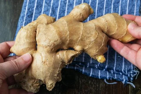 Fresh ginger on rustic background Stock Photos