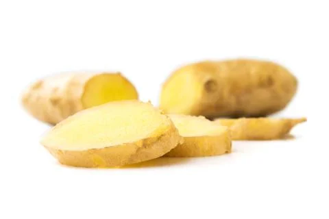 Fresh ginger on white background, raw material for cooking, selective focus Stock Photos