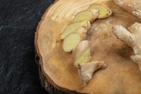 Fresh gingers rhizome or root on a wooden board Stock Photos