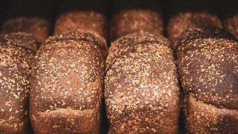 Fresh grain bread on the table closeup Stock Photos