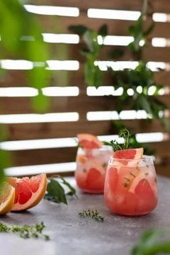 Fresh grapefruit cocktail. Fresh summer cocktail with grapefruit, thyme and i Stock Photos