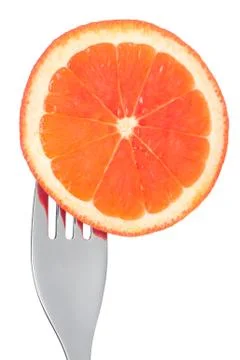 Fresh grapefruit slice on a fork isolated Stock Photos