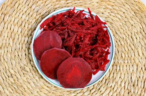 Fresh grated beets in a plate. Beetroot salad with raw vegetables. Stock-Fotos