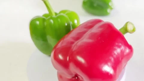 Fresh green and red bell peppers close up. Stock Footage 340938178