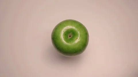 Fresh green apple. On the rotating table Stock Footage 128764127