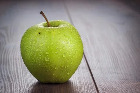 Fresh green apple on the table Stock Photos