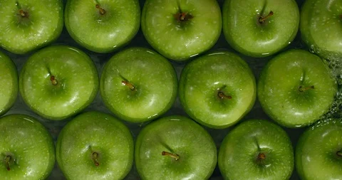 Fresh Green Apples being washed by water. Washing Fruits. Stock-Footage 97410208