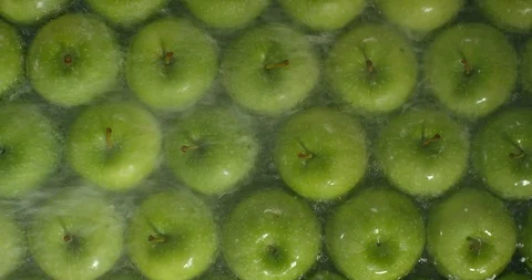 Fresh Green Apples being washed by water. Washing Fruits. Stock-Footage 97410358