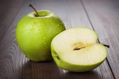 Fresh green apples on the table Stock Photos