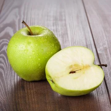 Fresh green apples on the table Stock Photos